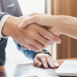 Image of two people shaking hands