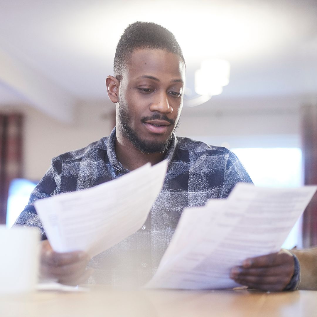 man looking through paperwork