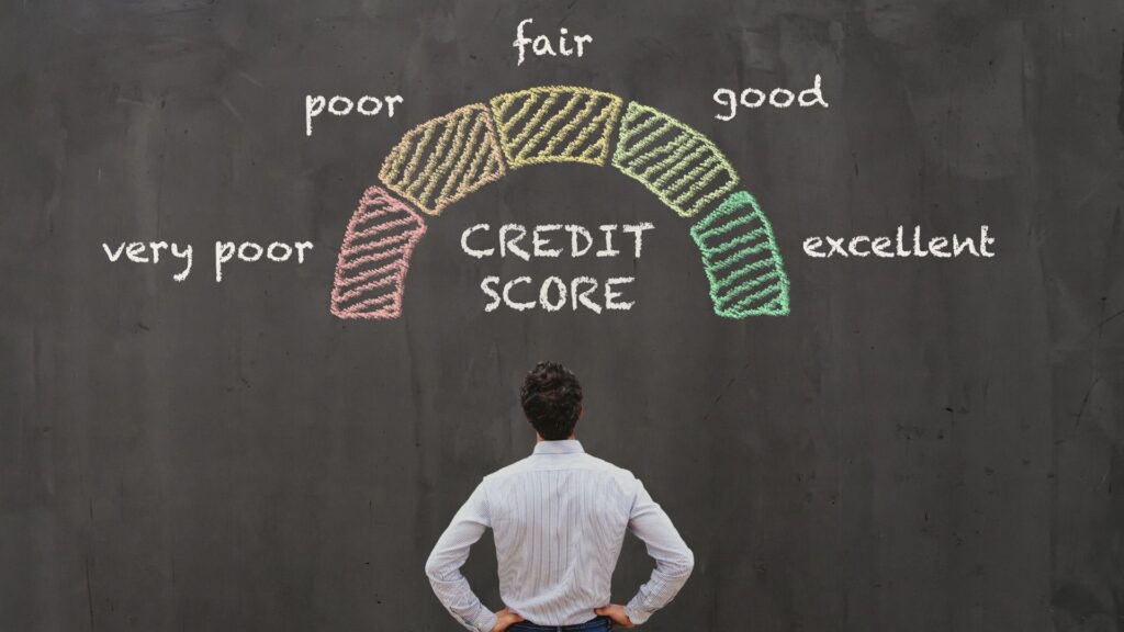 A man looks at a credit score scale