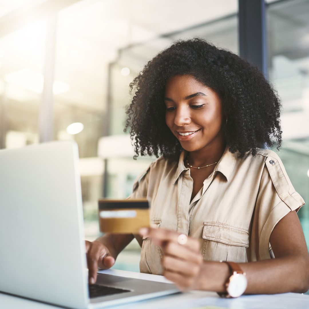 woman looking at her credit card