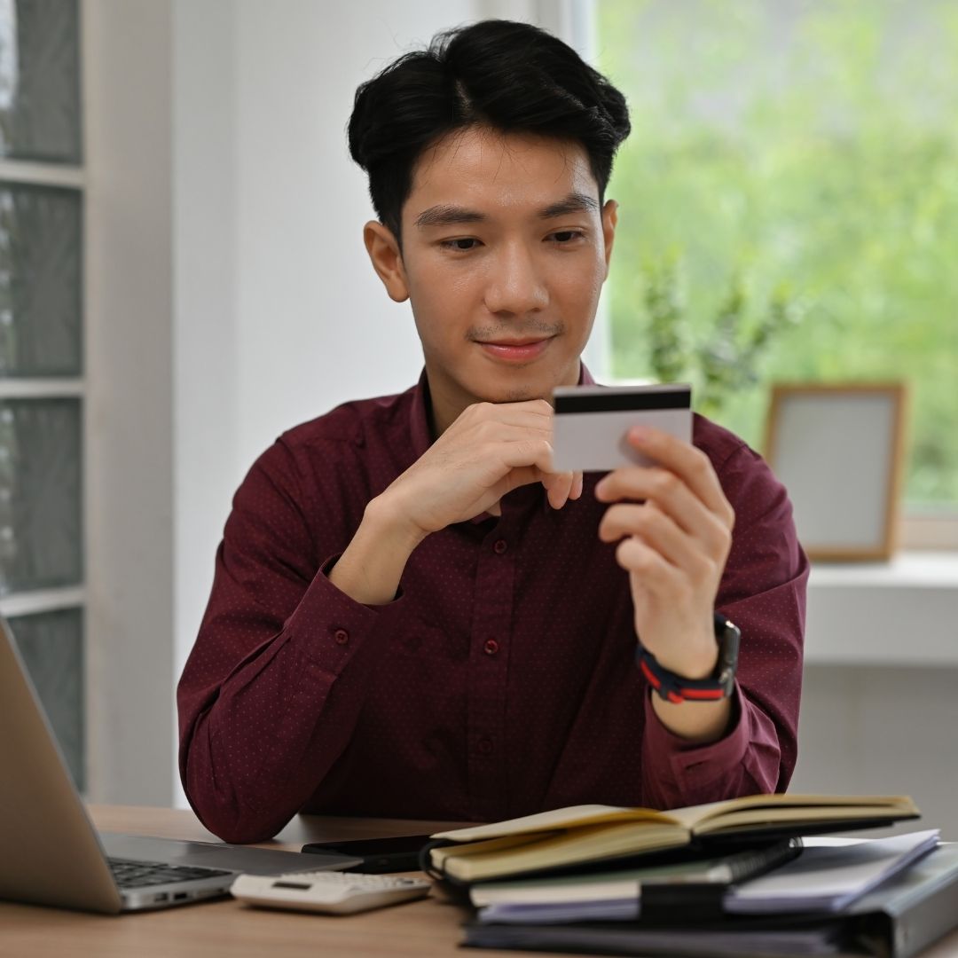 person looking at a credit card
